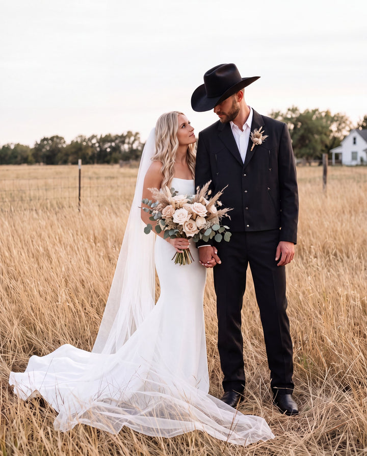 Black western suit at a country wedding
