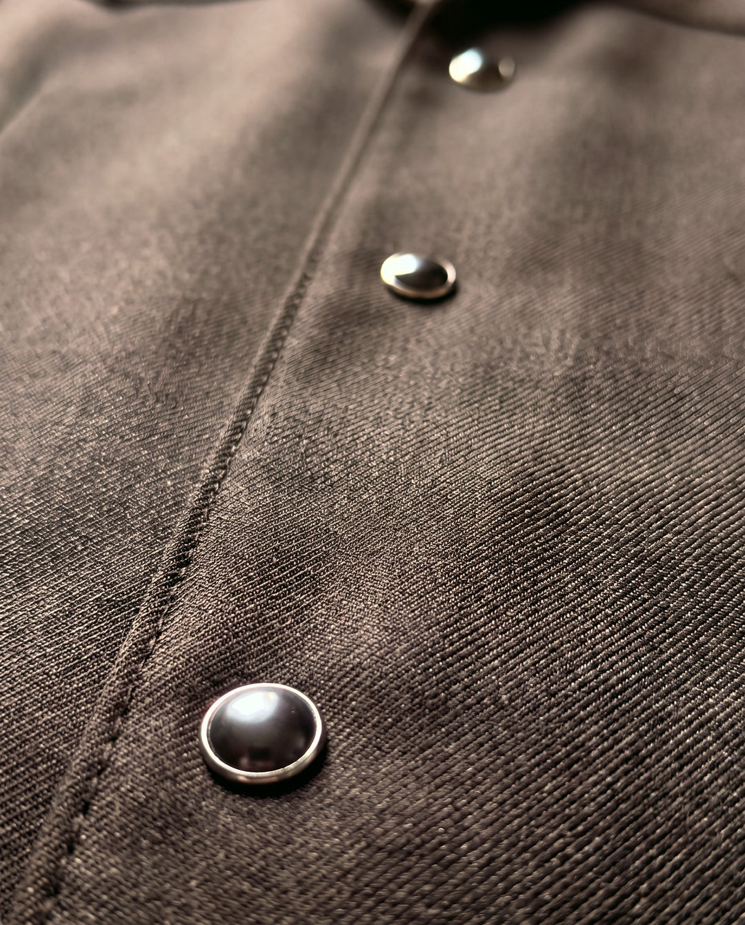 Pearl snap detail, brown western suit